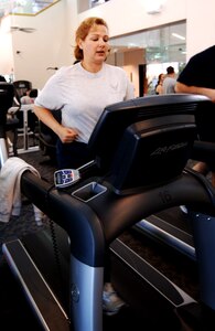 LANGLEY AIR FORCE BASE, Va. -- Maj. Kathryn Bienfang, Air Combat Command Public Affairs action officer, runs on a treadmill at the Shellbank Fitness center. Major Bienfang said finding time to work out is hard with her busy schedule, but it is essential to getting in better shape. (U.S. Air Force photo/Airman 1st Class Jason J. Brown)