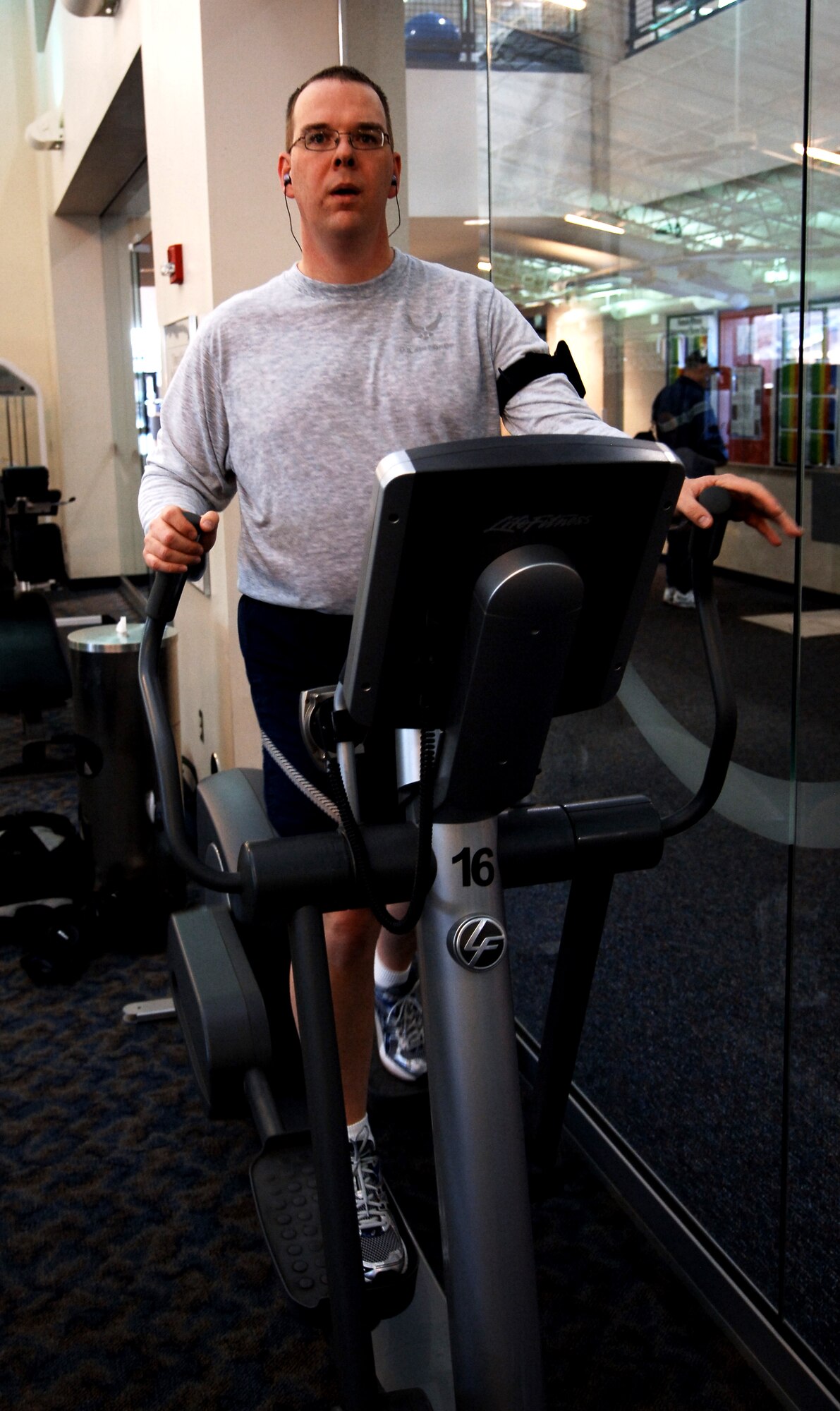 LANGLEY AIR FORCE BASE, Va. -- Master Sgt. Tilo Baisden, 480th Intelligence, Surveillance and Reconnaissance Wing Manpower superintendent, works out on an elliptical cross-trainer at the Shellbank Fitness Center. Sergeant Baisden introduced early morning physical training sessions to help him shape up. (U.S. Air Force photo/Airman 1st Class Jason J. Brown)