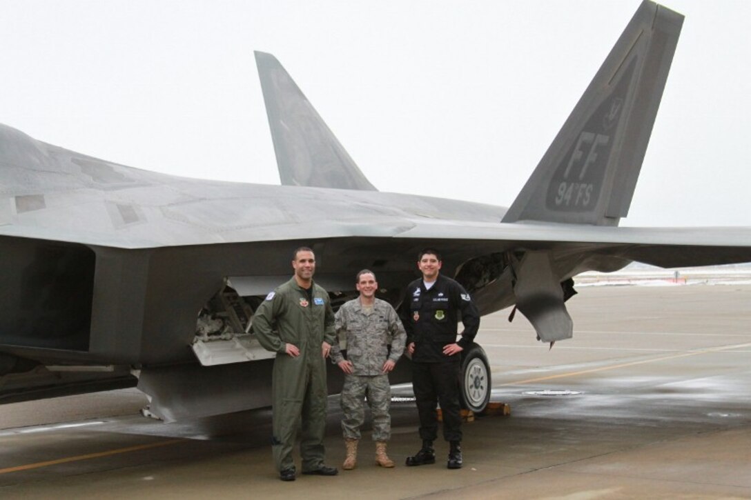 LANGLEY AIR FORCE BASE, Va. -- Lt. Col. Adrian Spain (left), 94th Fighter Squadron commander, Staff Sgt John Lugo dedicated crew chief, and Airman 1st Class Brendan Carroll assistant dedicated crew chief, stand next to the 94 FS flagship one last time prior to its departure Feb. 8.  A/C 05-094 is being transferred to Holloman Air Force Base, NM, as part of Air Combat Command's common configuration initiative and will eventually be replaced by a/c -194. (Courtesy photo)