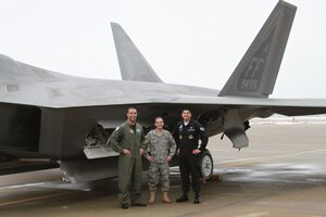 LANGLEY AIR FORCE BASE, Va. -- Lt. Col. Adrian Spain (left), 94th Fighter Squadron commander, Staff Sgt John Lugo dedicated crew chief, and Airman 1st Class Brendan Carroll assistant dedicated crew chief, stand next to the 94 FS flagship one last time prior to its departure Feb. 8.  A/C 05-094 is being transferred to Holloman Air Force Base, NM, as part of Air Combat Command's common configuration initiative and will eventually be replaced by a/c -194. (Courtesy photo)