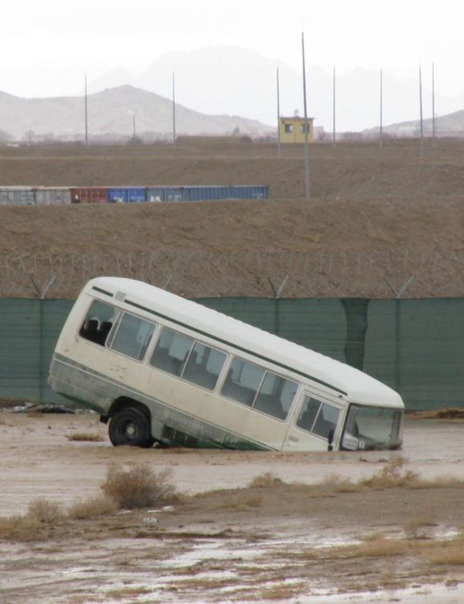 The 451st Expeditionary Logistics Readiness Squadron spent much of the day on Feb. 8, 2010, pulling vehicles out of mud and ditches after a flash flood occured on Kandahar Airfield, Afghanistan. (U.S. Air Force photo by Capt. Lori Mann/Released)