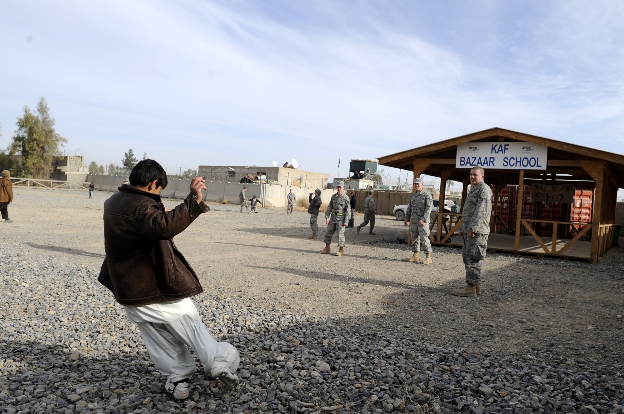 Members from the 451st Air Expeditionary Wing volunteer at the Bazaar School Feb. 15, 2010.  The Bazaar School is a place where local Afghan kids can play games and participate in activities with military members from Kandahar Airfield.  (U.S. Air Force photo/Senior Airman Nancy Hooks/Released)