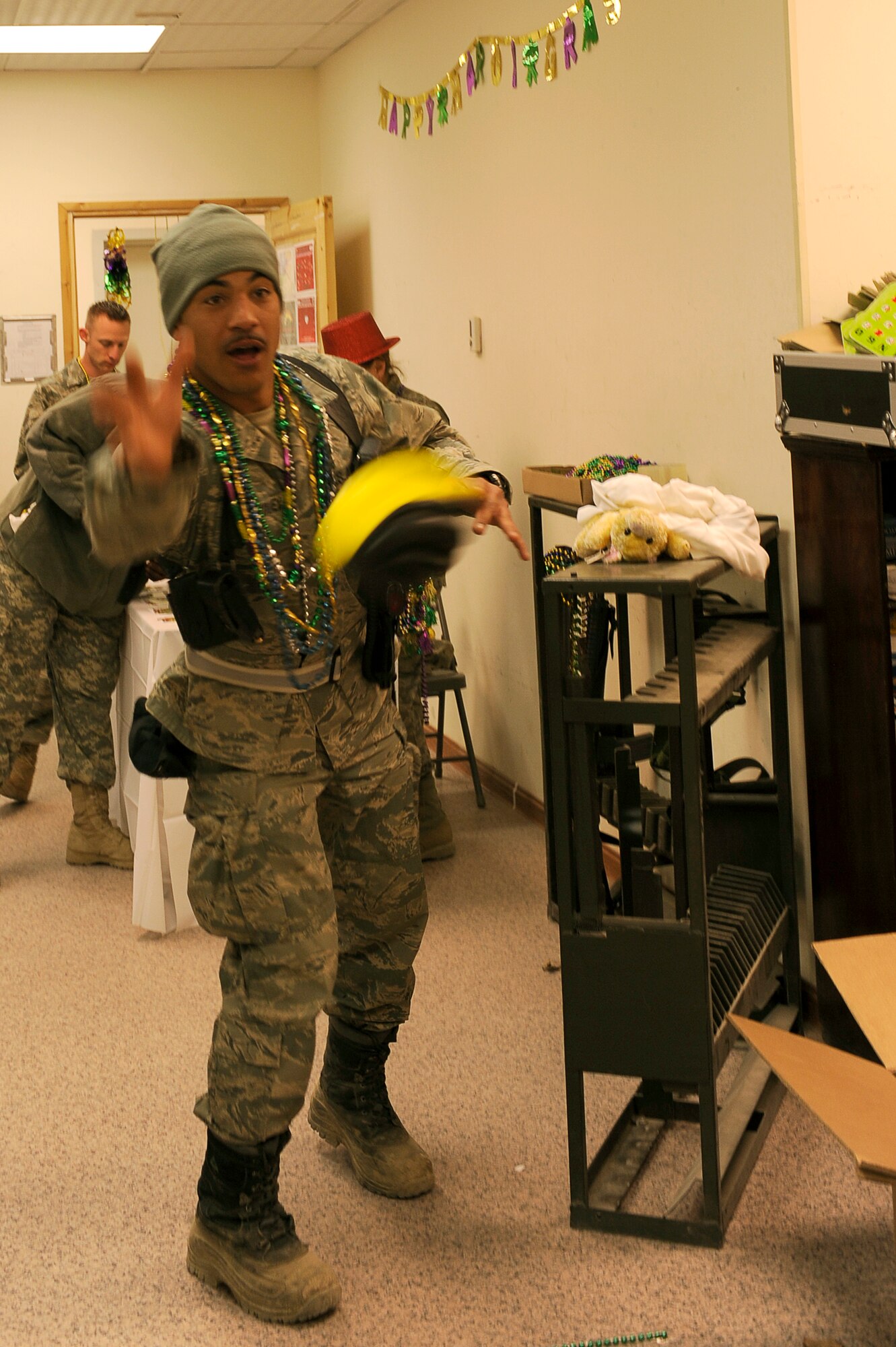 U.S. Air Force Staff Sgt. Robert McKinney, 455th Expeditionary Communications Squadron, plays a game during Mardi Gras festivities at Bagram Airfield, Afghanistan, Feb. 15, 2010. Sgt McKinney is deployed from Fort Meade, Md. and is from San Antonio, Texas. (U.S. Air Force photo by/ Tech. Sgt. Jeromy K. Cross/released)




