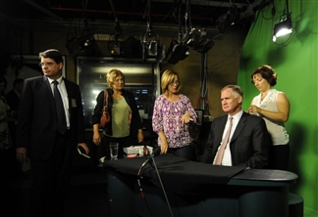 Deputy Secretary of Defense William J. Lynn III prepares for a television interview on the Australian late news show "Late Line" in Canberra, Australia, on Feb. 15, 2010.  