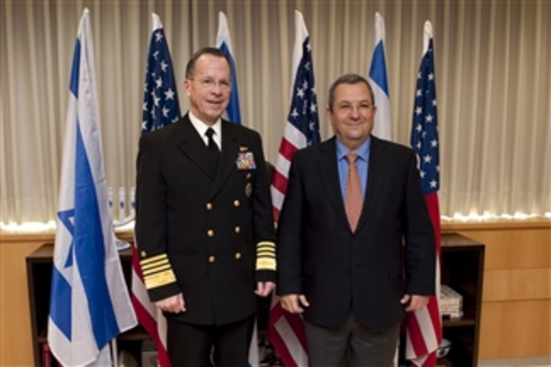 Chairman of the Joint Chiefs of Staff Adm. Mike Mullen, U.S. Navy, poses for photos with Israeli Minister of Defense Ehud Barak in Tel Aviv, Israel, on Feb. 15, 2010.  Mullen is on a weeklong tour of the region visiting with key partners and allies.  