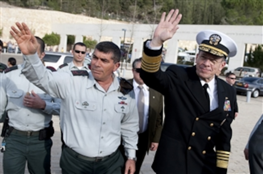 Chief of Defense Israeli Defense Force Lt. Gen. Gabi Ashkenazi and Chairman of the Joint Chiefs of Staff Adm. Mike Mullen, U.S. Navy, wave to onlookers at the Yad Ve Shem Holocaust Memorial Museum in Jerusalem, Israel, on Feb. 15, 2010.  Mullen is on a weeklong tour of the region visiting with key partners and allies.  