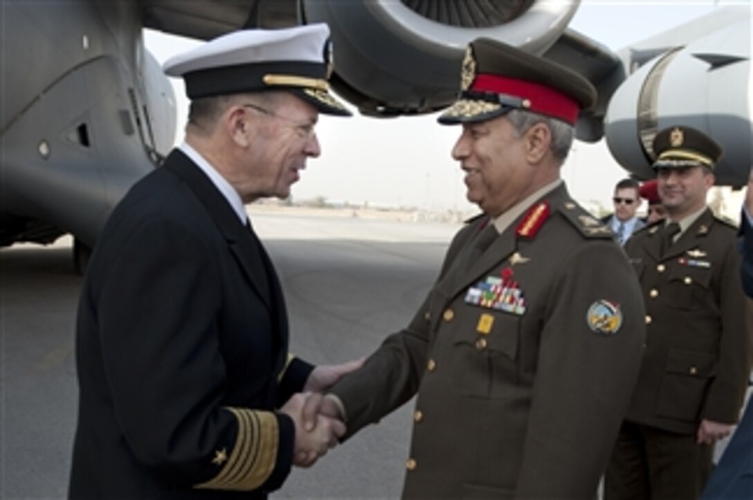 Chairman of the Joint Chiefs of Staff Adm. Mike Mullen, U.S. Navy, is greeted by Egyptian Maj. Gen. Hassan Roweny after his arrival in Cairo, Egypt, on Feb. 13, 2010.  Mullen is on a weeklong tour of the region visiting with key partners and allies.  