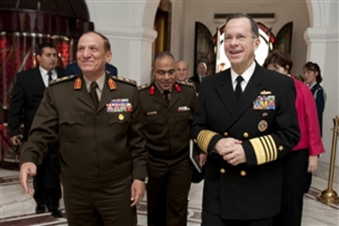 Chairman of the Joint Chiefs of Staff Adm. Mike Mullen, U.S. Navy, is greeted by Egyptian Armed Forces Chief of Staff Lt. Gen. Sami Hafez Enan in Cairo on Feb. 14, 2010.  Mullen is on a weeklong tour of the region visiting with key partners and allies.  