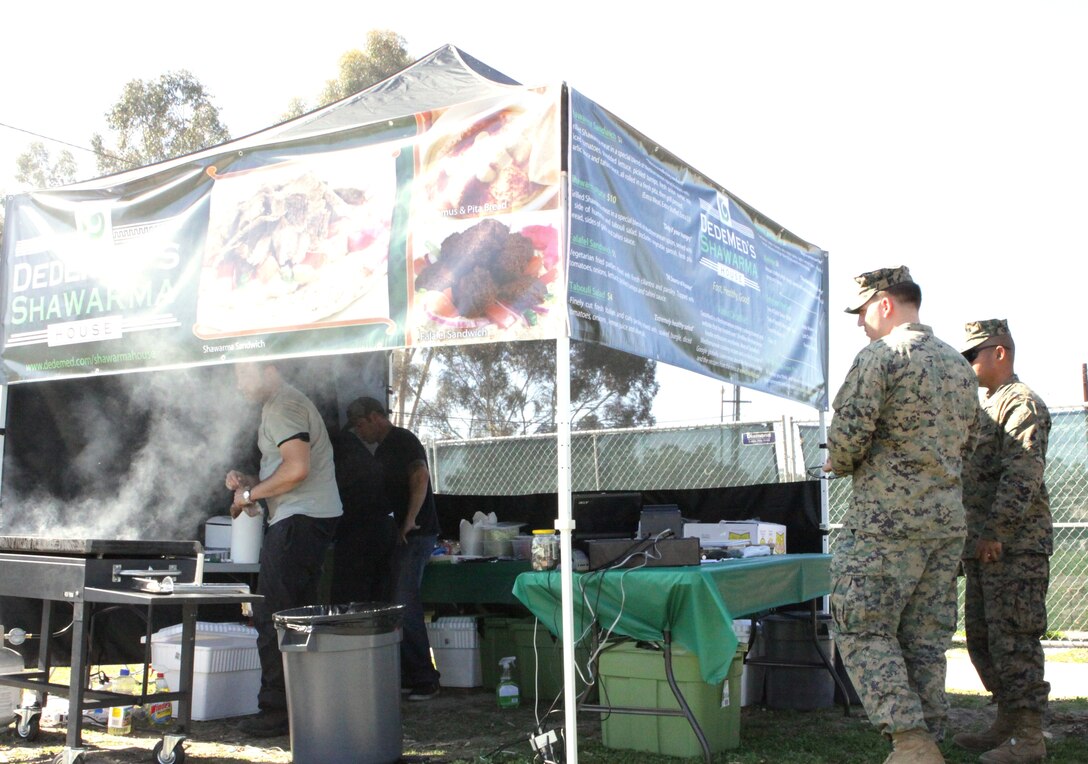 Marines wait for their meals of shawarma sandwiches and falafels at the DedeMed’s Shawarma House stand in the 14 Area of Camp Pendleton, Feb. 16. Currently, DedeMed’s Shawarma House is in the “rotational concession” stage of Camp Pendleton’s eateries. In this stage, the eatery travels to different camps on various days to determine the success rate of Mediterranean food on the base. Marine Corps Community Services is constantly testing new dining options for service members to make them feel more at home.