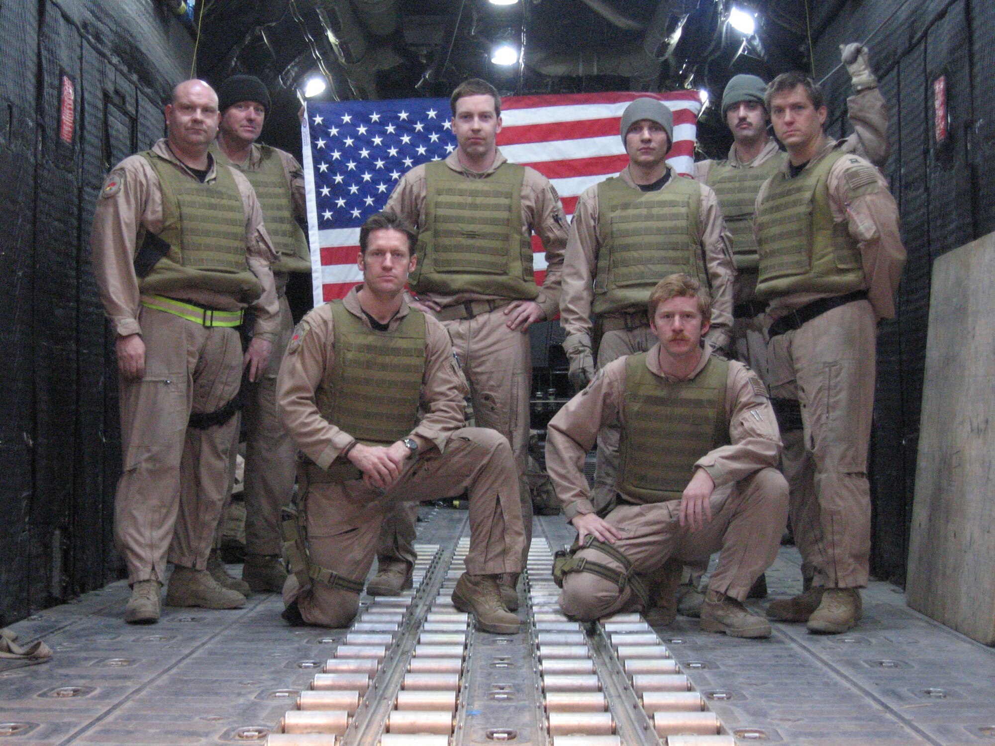 The members of the 17th Special Operations Squadron crew that rescued three critically injured coalition members pose for a photo in the back of a MC-130P Combat Shadow before a mission. The MC-130P crew for the rescue mission are from left to right: (standing) Master Sgt. Brian Smith, Master Sgt. Don Fannin, 1st Lt. Jedadiah Koval, Senior Airman Neil Hampton, , Staff Sgt. Tim Sammis, Capt. Casey Moores, (kneeling) Capt. Adam Asleson and Capt. Luke Deckard.