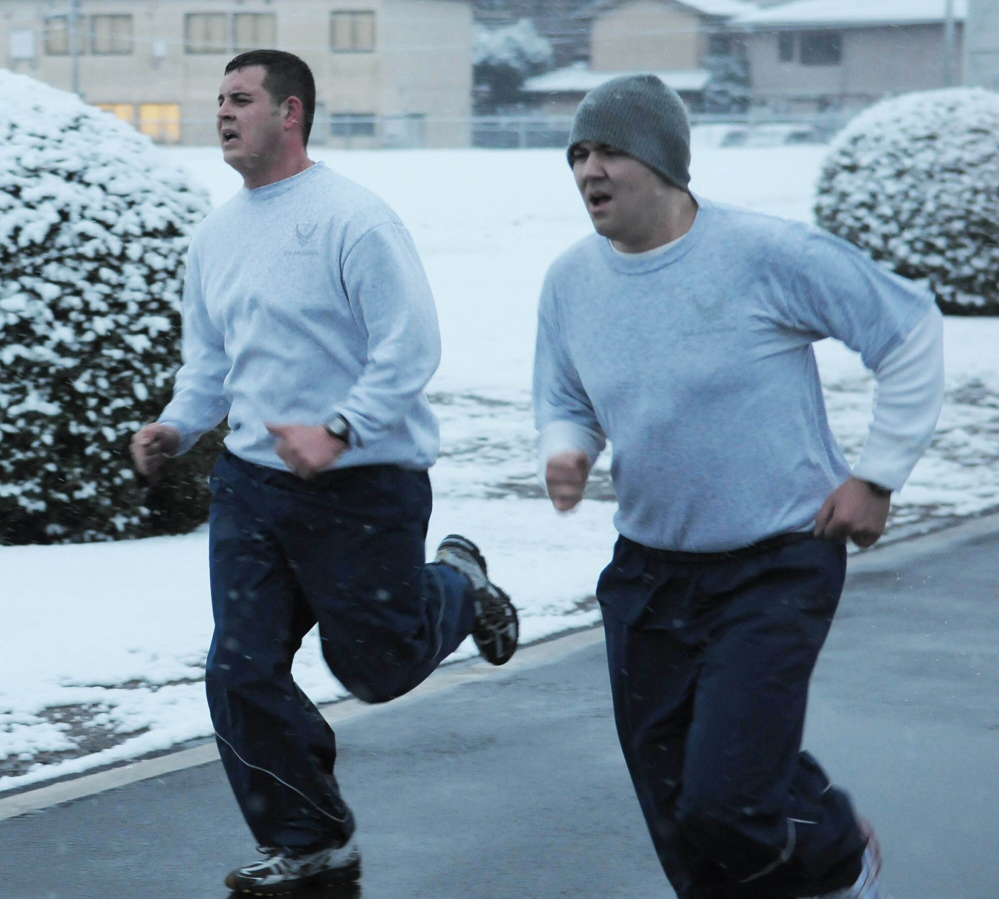 YOKOTA AIR BASE, Japan -- Two Airmen finish a run Feb. 18 during the Warrior Run Program. The purpose of the program is to ensure that airmen have all the tools needed to meet physical fitness standards. (U.S. Air Force photo/Airman 1st Class Sean Martin)