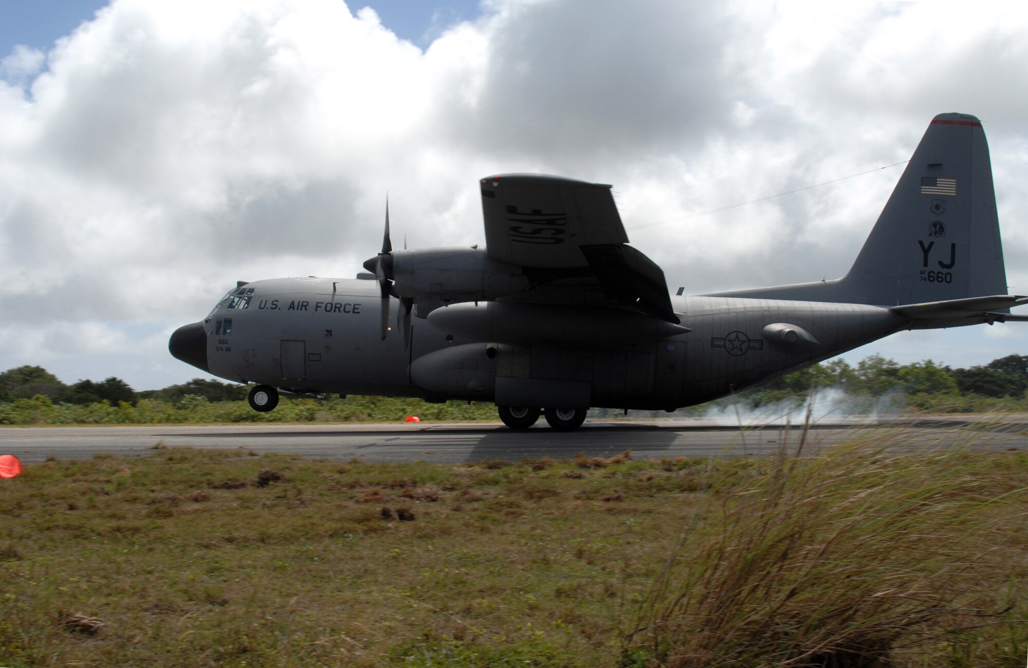 A C-130 Hercules lands at Northwest Field, next to Andersen Air Force Base, Guam, Feb. 17.  The 36th Contingency Response Group at Andersen and the 374th Operations Group from Yokota Air Base, Japan, participated in a mock deployment to Northwest Field to rehearse time-critical actions for disaster relief operations.
(USAF photo by Capt. Andrew G. Hoskinson)