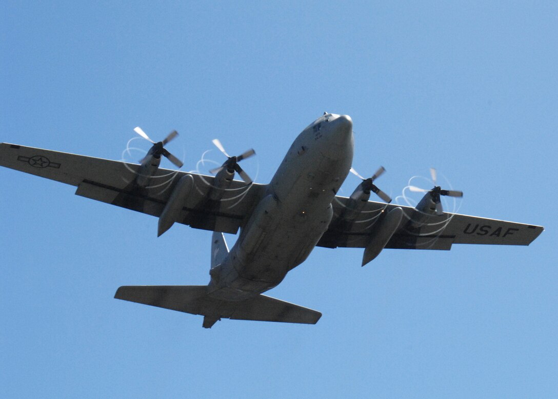 A C-130 Hercules takes off over Northwest Field, next to Andersen Air Force Base, Guam, Feb. 17.  The 36th Contingency Response Group at Andersen and the 374th Operations Group from Yokota Air Base, Japan, participated in a mock deployment to Northwest Field to rehearse time-critical actions for disaster relief operations.
(USAF photo by Capt. Andrew G. Hoskinson)