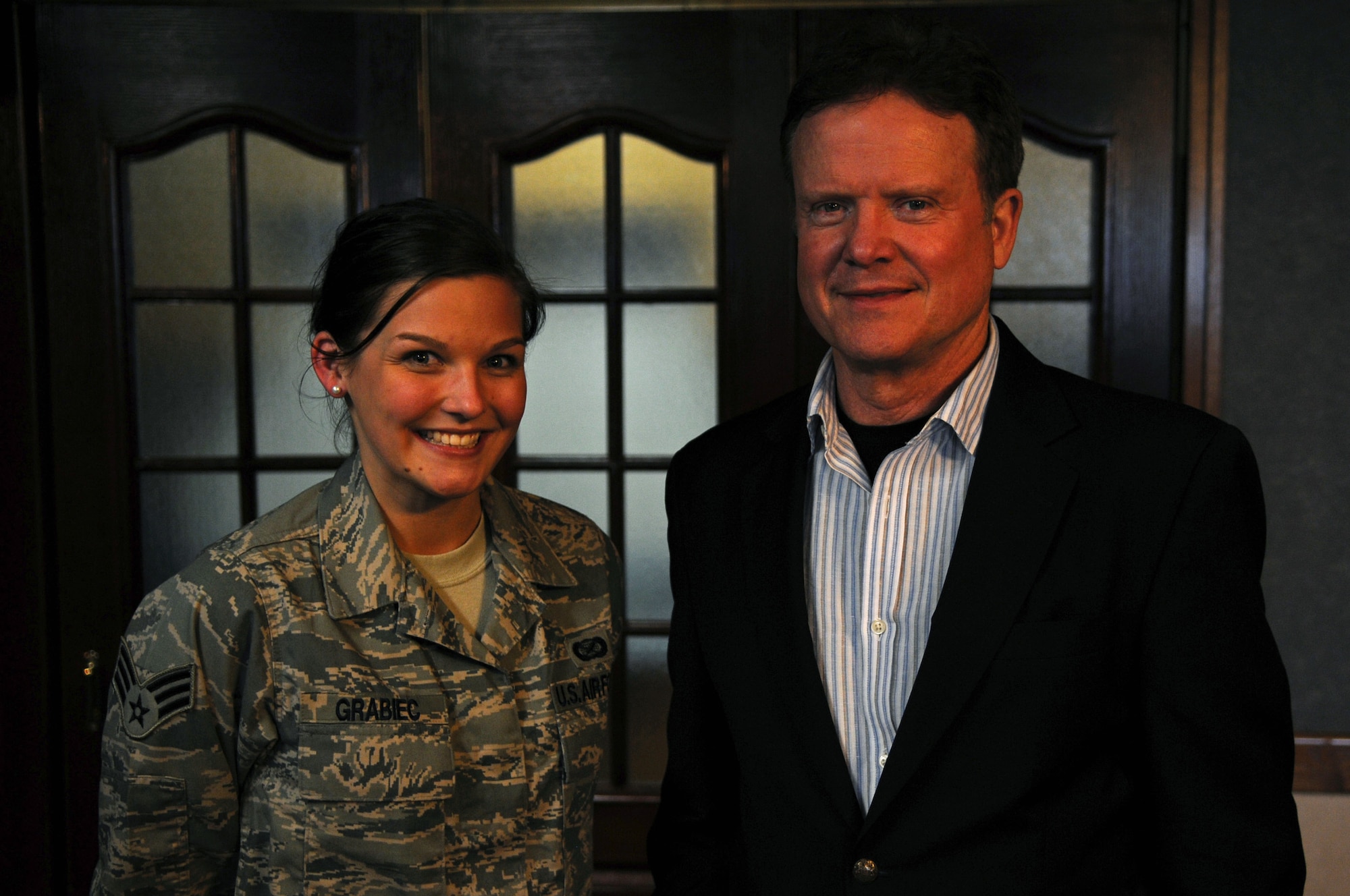 Senior Airman Amanda Grabiec of 18th Wing Public Affairs and constituent of Virginia, meets Senator Jim Webb of Virginia at Kadena Air Base, Feb 17. Sen. Webb received an 18th Wing mission brief and a tour of the base as part of a multi-service visit to Okinawa. (U.S. Air Force photo by Brig. Gen. Ken Wilsbach)