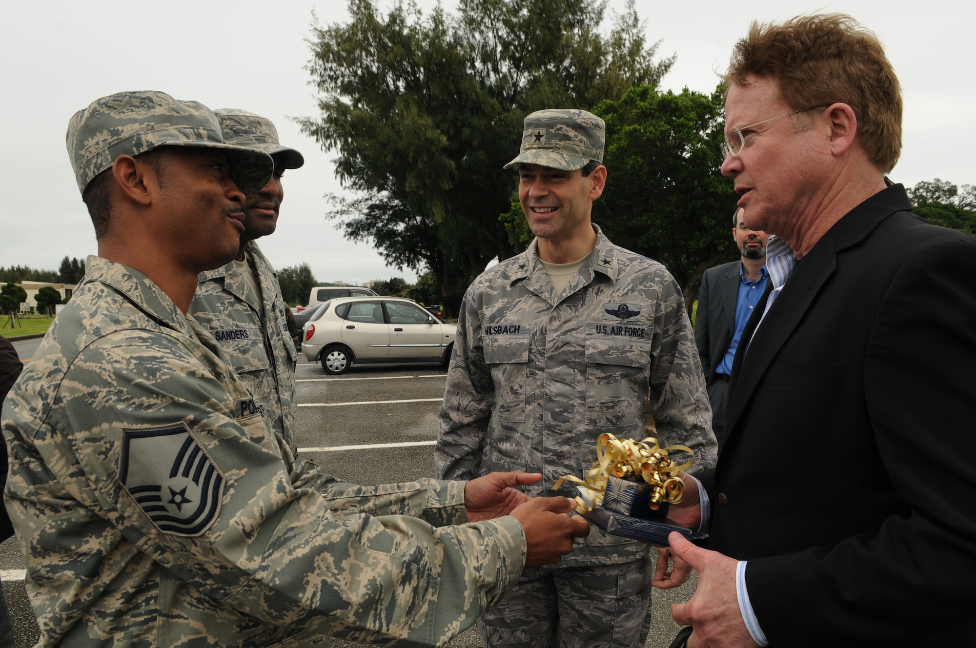 Senator Jim Webb of Virginia is greeted by Brig. Gen. Ken Wilsbach, 18th Wing commander and constituents Master Sgt. Wesley Poindexter of the 18th Operation Support Squadron and Tech. Sgt. Brent Sanders of the 18th Wing at Kadena Air Base, Feb 17. Sen. Webb received an 18th Wing mission brief and a tour of the base as part of a multi-service visit to Okinawa. (U.S. Air Force photo by Senior Airman Amanda N. Grabiec)