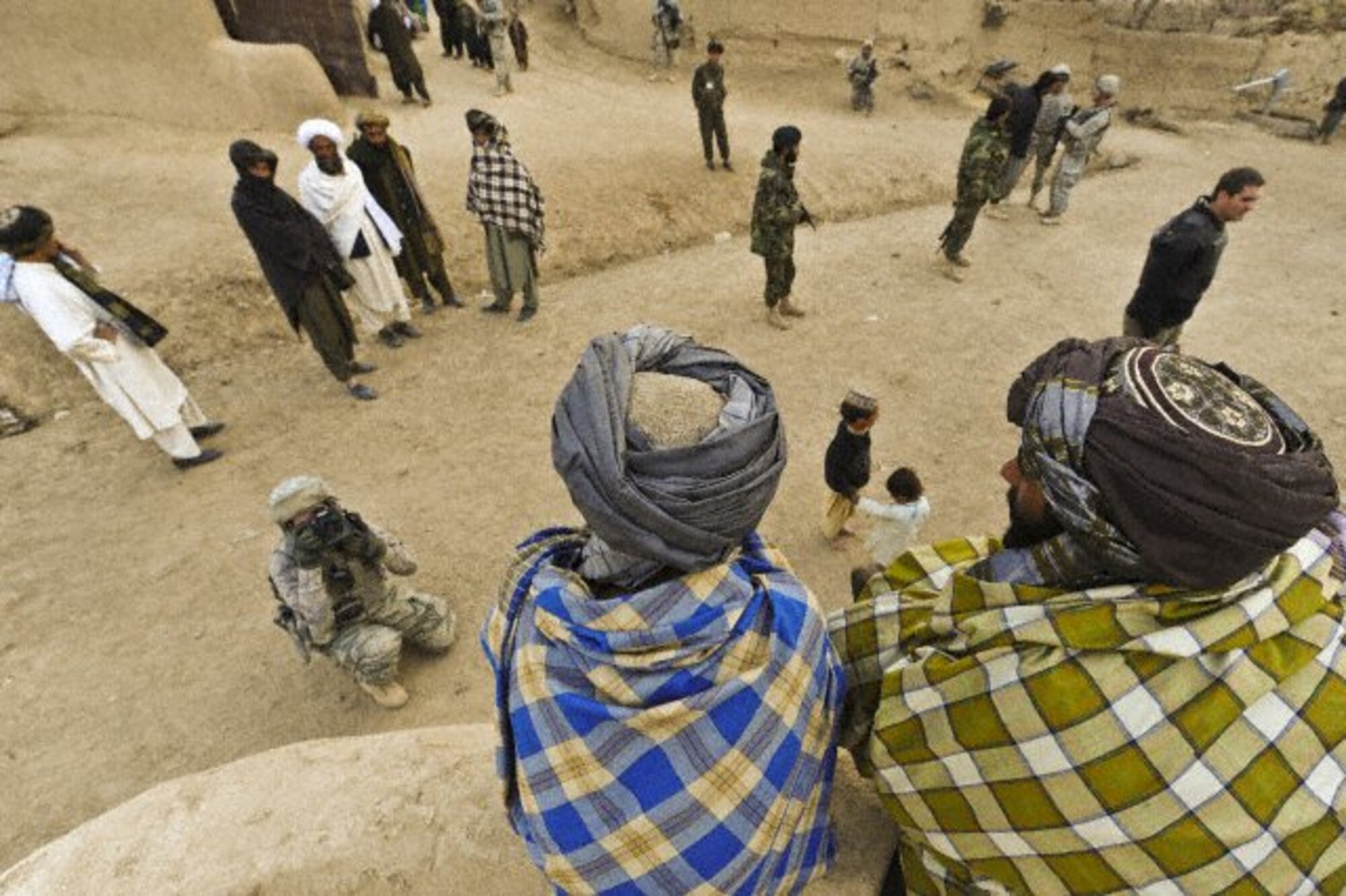 Afghan nationals have their photo taken by Staff Sgt. Christine Jones 4th Combat Camera Squadron, Shabila Kalan Village, Zabul Province, Afghanistan. (U.S. Air Force photo by Tech. Sgt. Efren Lopez )

