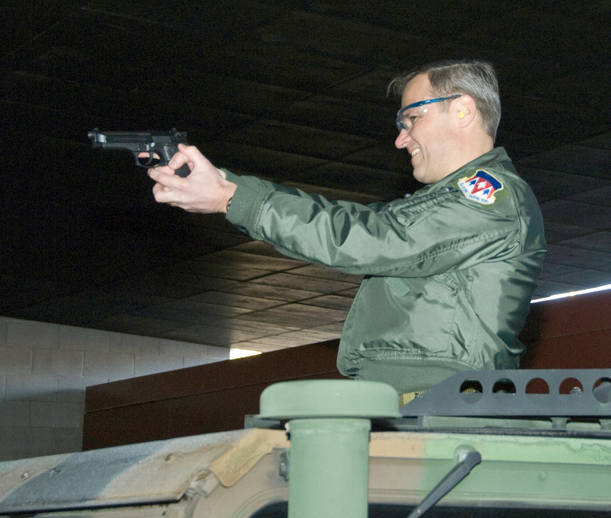 Col. Chris Nowland, the 71st Flying Training Wing commander, engages tactical targets from a Humvee during the official opening of the base firing range, Feb. 17. The range had been closed for a 14-month, $2.1 million renovation. (U.S. Air Force photo/ Terry Wasson)

