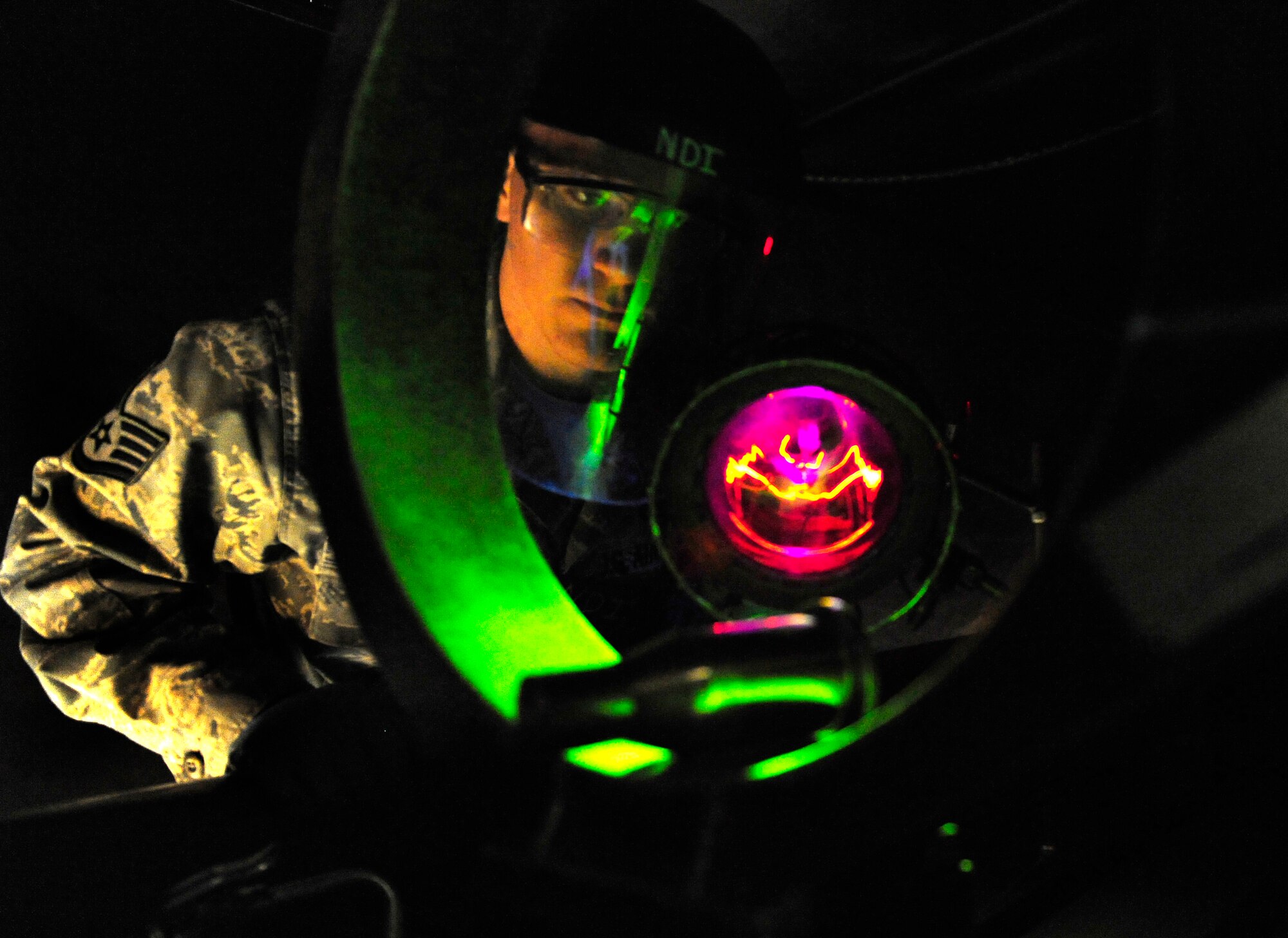 HOLLOMAN AIR FORCE BASE, N.M. -- Staff Sgt. Zachery Doering, 49th Maintenance Squadron non-destructive inspection specialist, checks the integrity of a main thrust pin by performing a magnetic particle inspection Feb. 11. A magnetic particle inspection reveals any surface and subsurface defects of magnetic metal items. The test is used on a case-by-case basis to determine whether or not the part will need to be replaced. (U.S. Air Force photo by Senior Airman Tiffany Trojca)