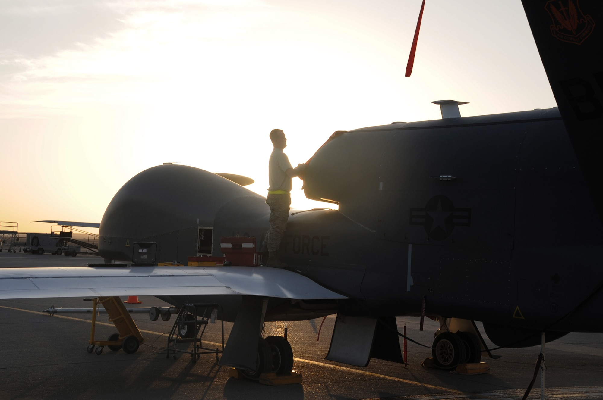 Staff Sgt. Michael Goenner goes through pre-flight servicing while preparing an RQ-4 Global Hawk for a combat mission Feb. 12, 2010, in Southwest Asia. The RQ-4s, assigned to the 380th Air Expeditionary Wing and deployed from Beale Air Force Base, Calif., achieved 1,500 combat sorties and 30,000 combat flying hours on Feb. 10 and 11 respectively. Sergeant Goenner is an RQ-4 Global Hawk crew chief with the 380th Expeditionary Aircraft Maintenance Squadron Hawk aircraft maintenance unit. (U.S. Air Force photo/Master Sgt. Scott T. Sturkol)