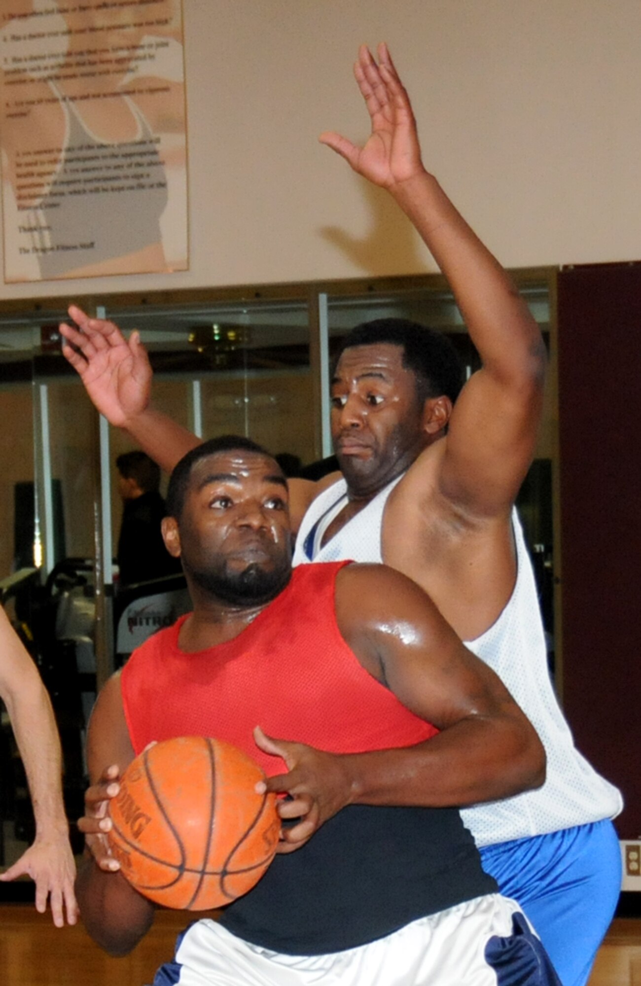 Leroy Jennings, left, 81st FSS-CPTS, is guarded by Jason Washington, 333rd TRS, as he turns toward the basket for a shot in the final game of the postseason tournament.  (U.S. Air Force photo by Kemberly Groue)