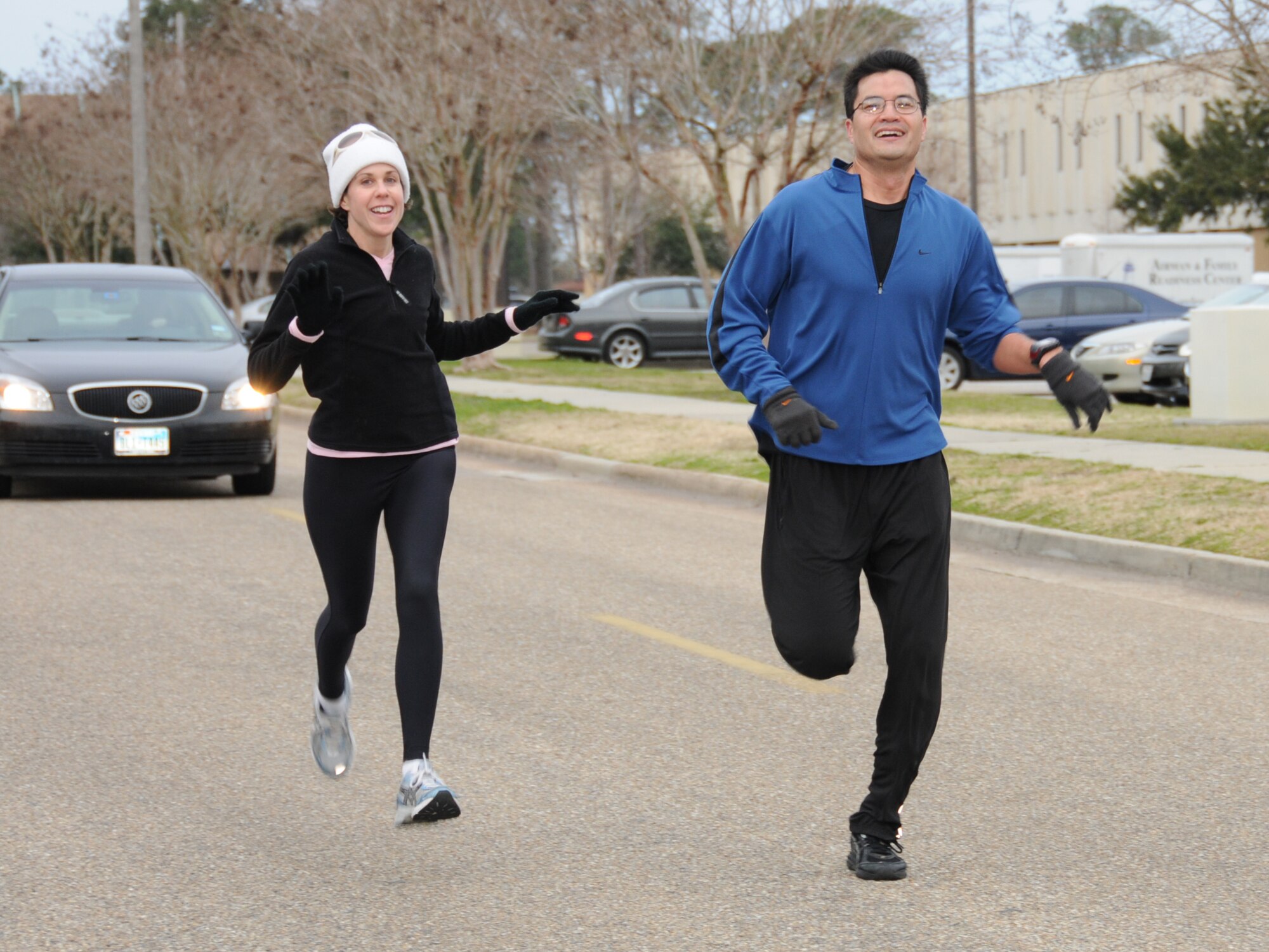 The first couple to cross the finish line of the Sweetheart Run, Jacqueline and Geoff Sasaki, boasted a time of 21:07.  He’s assigned to the 81st Diagnoistic and Therapeutics Squadron.  The 5-kilometer race began and ended at Blake Fitness Center Feb. 11.  (U.S. Air Force photo by Kemberly Groue)