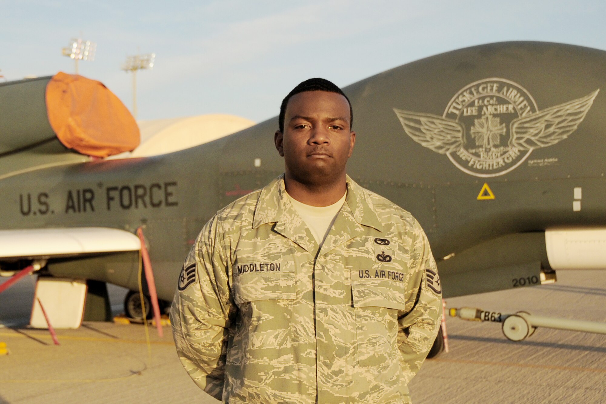 Staff Sgt. Michael Middleton created a chalk nose art design honoring a Tuskegee Airman on an RQ-4 Global Hawk at an air base in Southwest Asia. Sergeant Middleton is assigned to the Global Hawk aircraft maintenance unit of the 380th Expeditionary Aircraft Maintenance Squadron. Tuskegee Airman Lt. Col. Lee Archer died Jan. 27, 2010, in New York City. (U.S. Air Force photo/Senior Airman Jenifer Calhoun)
