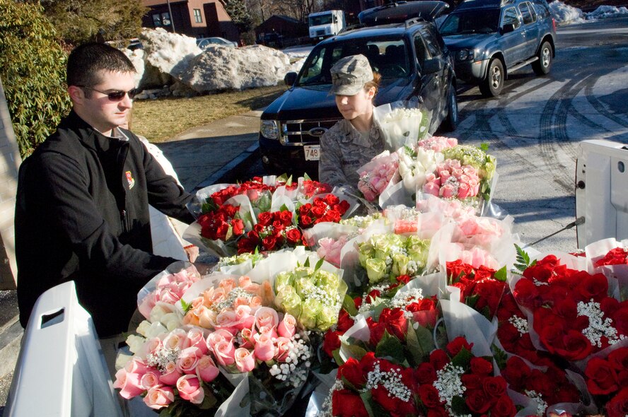 First Lt. Matt Frebert and 1st Lt. Holly Chernuchin unload roses Feb. 12 at the start of the Company Grade Officer's Council Valentine's Day flower sale. The CGOC sold more than 300 dozen roses during the sale, raising proceeds that help support Hanscom community events throughout the year. (U.S. Air Force photo by Mark Wyatt)