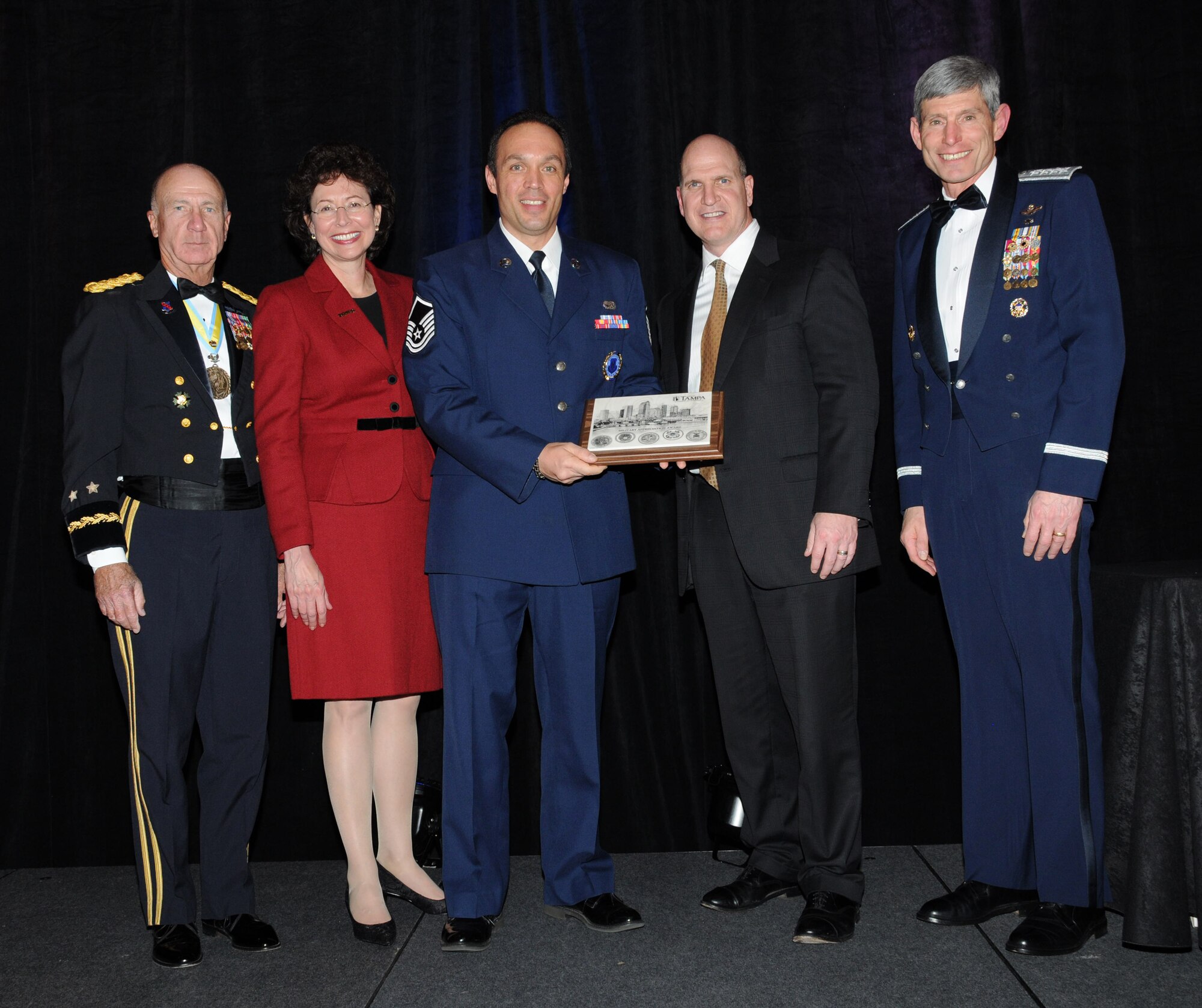 Master Sgt. Kevin M. French Jr., the In-Service Recruiter for the Air Force Reserve Command, accepts his Air Force Recruiter of the Year Award at the Tampa Chamber of Commerce Military Appreciation Banquet on Feb. 16, 2010. (U.S. Air Force photo/Tech.Sgt. Denise Hauser) 