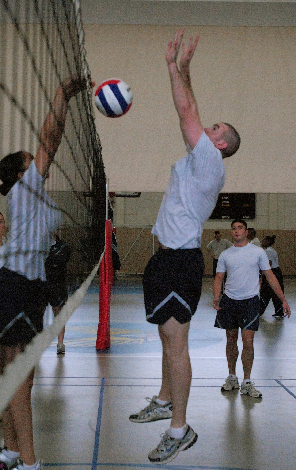 2nd Lt. Alexander Roman, 315th Training Squadron, attempts to block the ball during a volleyball match as part of the 17th Training Wing Sports Day on Feb. 12 Goodfellow AFB, Texas took the day to hold multiple sporting events, including volleyball, tennis, and  dodge ball, with each unit competing for commander’s cup points.  (U.S. Air Force photo/Master Sgt. Randy Mallard)