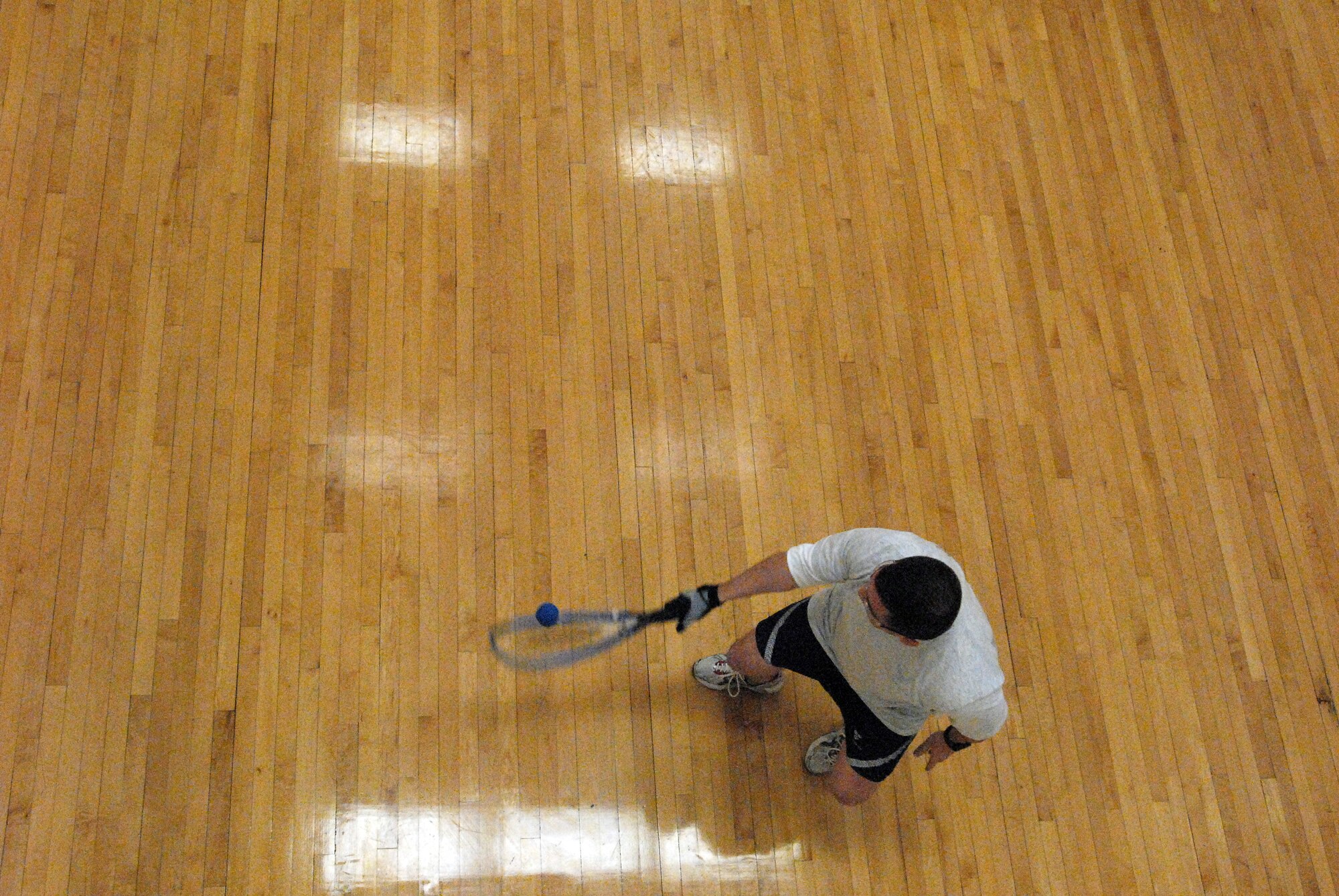 Capt. Jesse Pink returns the ball in racquet ball match during the 17th Training Wing Sports Day on Feb. 12. Capt. Pink went on to win his match 10-6 and advanced to the next round. Goodfellow AFB, Texas took the day to hold multiple sporting events, including volleyball, tennis, and dodge ball, with each unit competing for commander’s cup points.  (U.S. Air Force photo/Master Sgt. Randy Mallard)