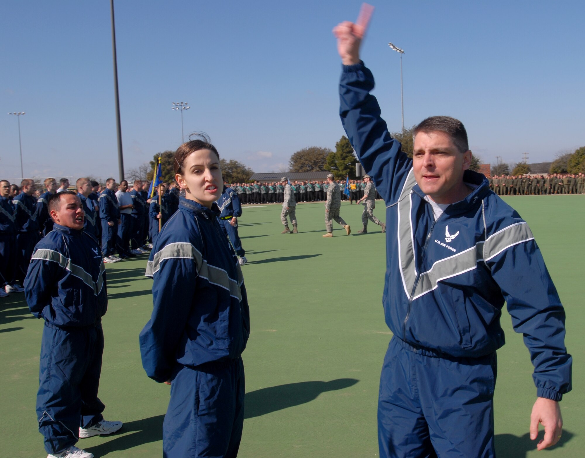Lt. Col. Erick Lawson, 316th Training Squadron commander, motivates his squadron prior to the start of the 17th Training Wing Sports Day on Feb. 12.  Goodfellow AFB, Texas took the day to hold multiple sporting events, including volleyball, tennis, and dodge ball, with each unit competing for commander’s cup points.  (U.S. Air Force photo/Master Sgt. Randy Mallard)