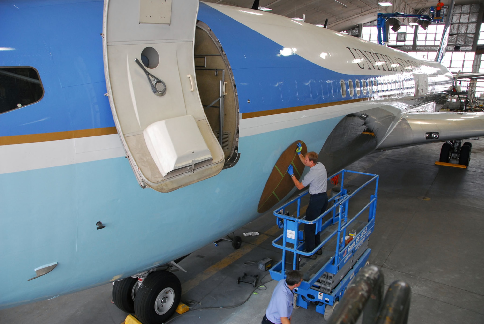 DAYTON, Ohio - Restoration specialists continue painting SAM 26000 in the restoration hangar at the National Museum of the U.S. Air Force. (U.S. Air Force photo)