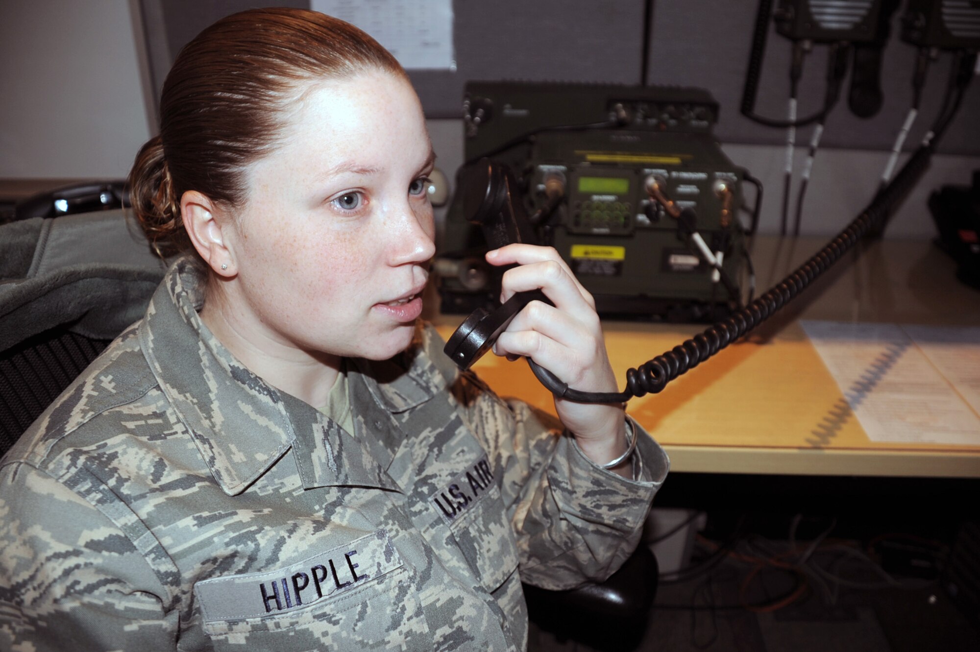 Staff Sgt. Tiffany Hipple, command post craftsman with the 380th Air Expeditionary Wing Command Post, talks over the radio in her operations area of the command post Feb. 3, 2010, at a non-disclosed location in Southwest Asia.  Sergeant Hipple is deployed from Air Force Material Command's command center at Wright-Patterson Air Force Base, Ohio and her hometown is Williamsburg, Va.  (U.S. Air Force Photo/Master Sgt. Scott T. Sturkol/Released)