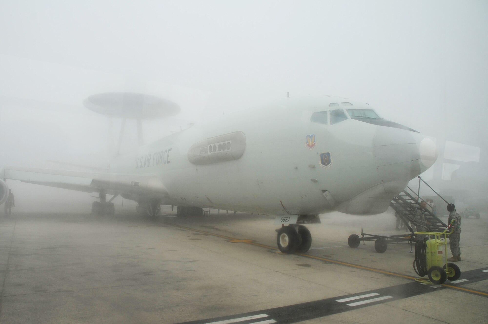 An E-3 Sentry Airborne Warning and Control System aircraft is shrouded by fog on the flightline of the 380th Air Expeditionary Wing at a non-disclosed base in Southwest Asia on Feb. 16, 2010. The E-3, which is assigned to the 965th Expeditionary Airborne Air Control Squadron, is deployed from Tinker Air Force Base, Okla.  The 380th AEW supports operations Iraqi Freedom and Enduring Freedom and the Combined Joint Task Force-Horn of Africa.  (U.S. Air Force Photo/Master Sgt. Scott T. Sturkol/Released)