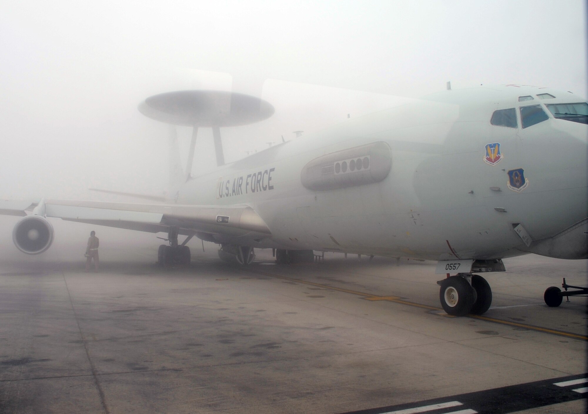 An E-3 Sentry Airborne Warning and Control System aircraft is shrouded by fog on the flightline of the 380th Air Expeditionary Wing at a non-disclosed base in Southwest Asia on Feb. 16, 2010. The E-3, which is assigned to the 965th Expeditionary Airborne Air Control Squadron, is deployed from Tinker Air Force Base, Okla.  The 380th AEW supports operations Iraqi Freedom and Enduring Freedom and the Combined Joint Task Force-Horn of Africa.  (U.S. Air Force Photo/Master Sgt. Scott T. Sturkol/Released)