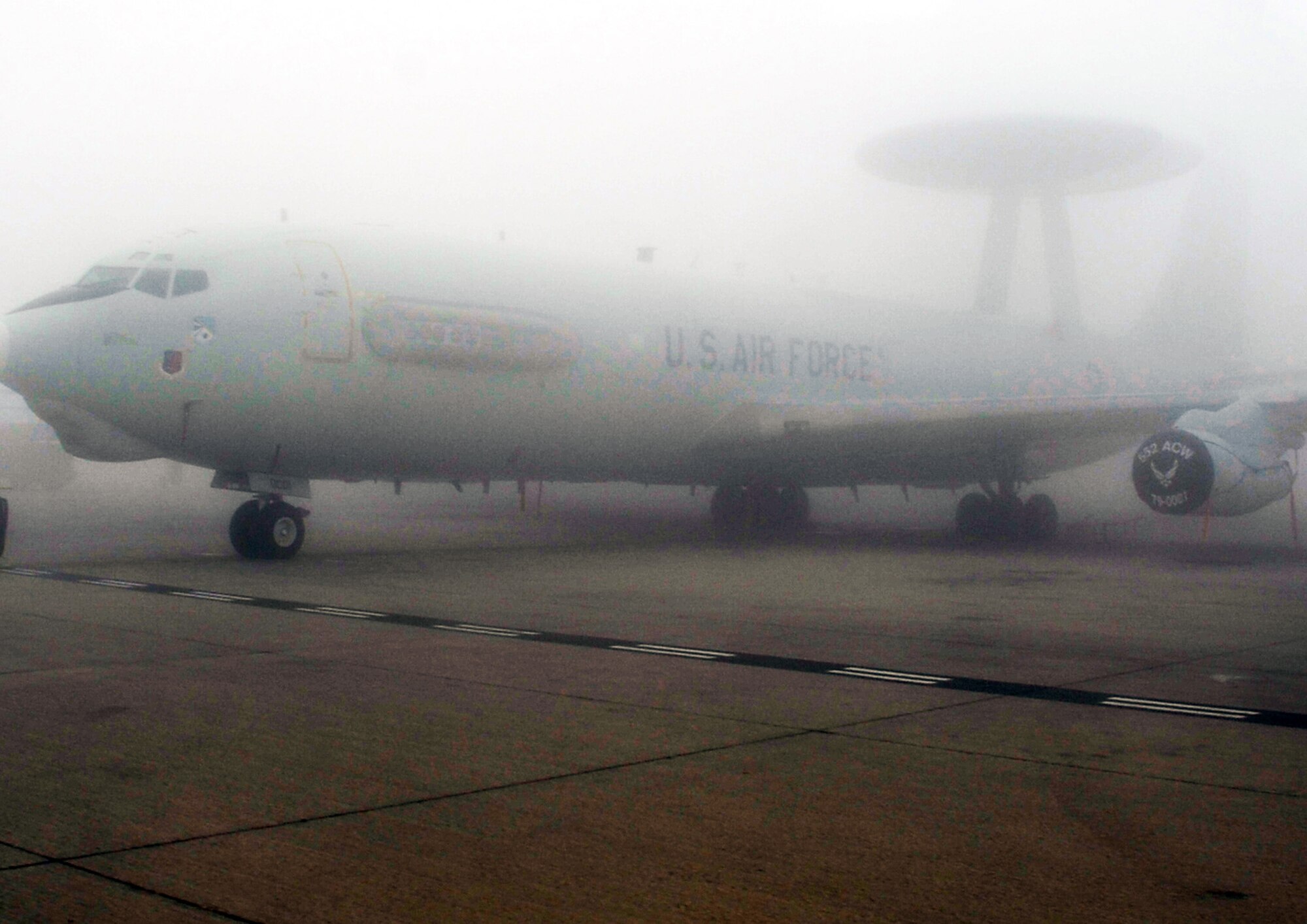 An E-3 Sentry Airborne Warning and Control System aircraft is shrouded by fog on the flightline of the 380th Air Expeditionary Wing at a non-disclosed base in Southwest Asia on Feb. 16, 2010. The E-3, which is assigned to the 965th Expeditionary Airborne Air Control Squadron, is deployed from Tinker Air Force Base, Okla.  The 380th AEW supports operations Iraqi Freedom and Enduring Freedom and the Combined Joint Task Force-Horn of Africa.  (U.S. Air Force Photo/Master Sgt. Scott T. Sturkol/Released)