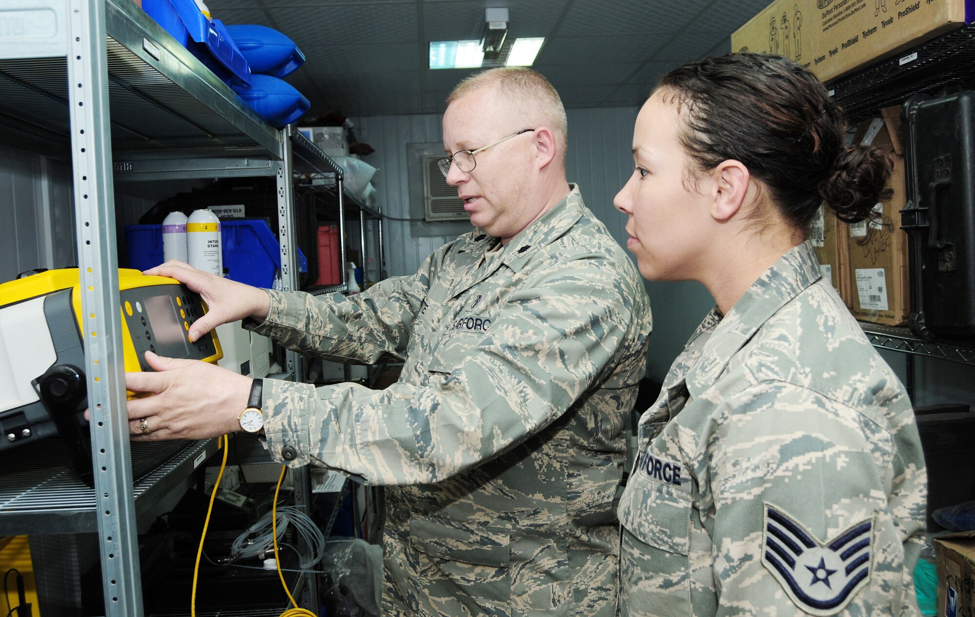 Lt. Col. Ronald Porte (left) and Staff Sgt. Nicole Logan review data on a gas chromatograph used to measure the concentration of volatile organic compounds in the enviornment Feb. 15, 2010, at an air base in Southwest Asia. Colonel Porte, deployed from Eglin Air Force Base, Fla., is part of the Air Force Medical Service Outstanding Bioenvironmental Engineering Team of the Year. Both Airmen are with the 386th Expeditionary Medical Group. (U.S. Air Force photo/Staff Sgt. Lakisha Croley/Released)  