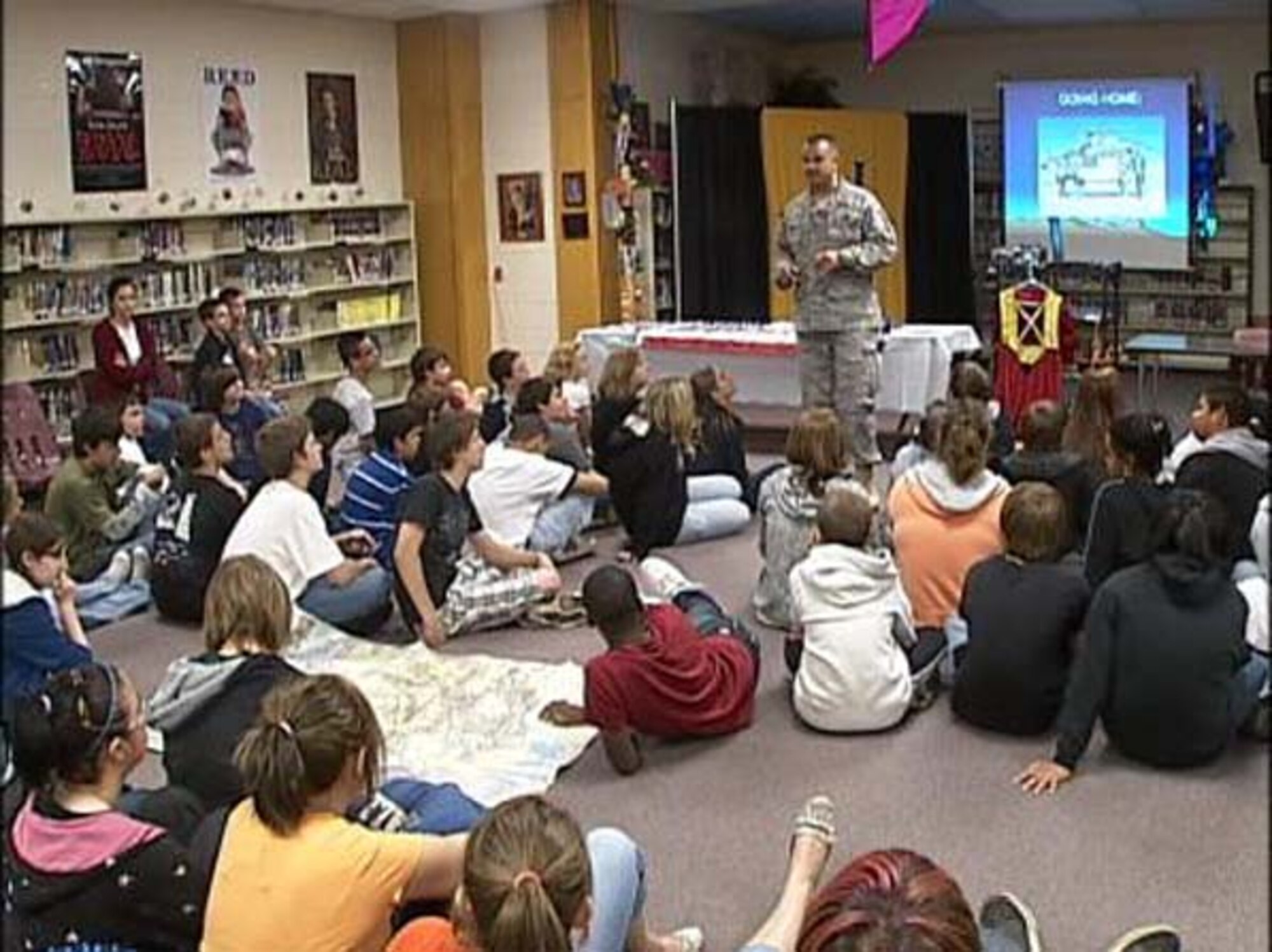 Major Robert Baird an Air Force Reservist from the 507th Air Refeuling Wing recently received a lifesaving award from actions performed in his civilian job as a Broken Arrow, Oklahoma police officer.  The major is shown here in a May 2009 file photo presenting a speech to a Broken Arrow elementary classroom on his military experiences.