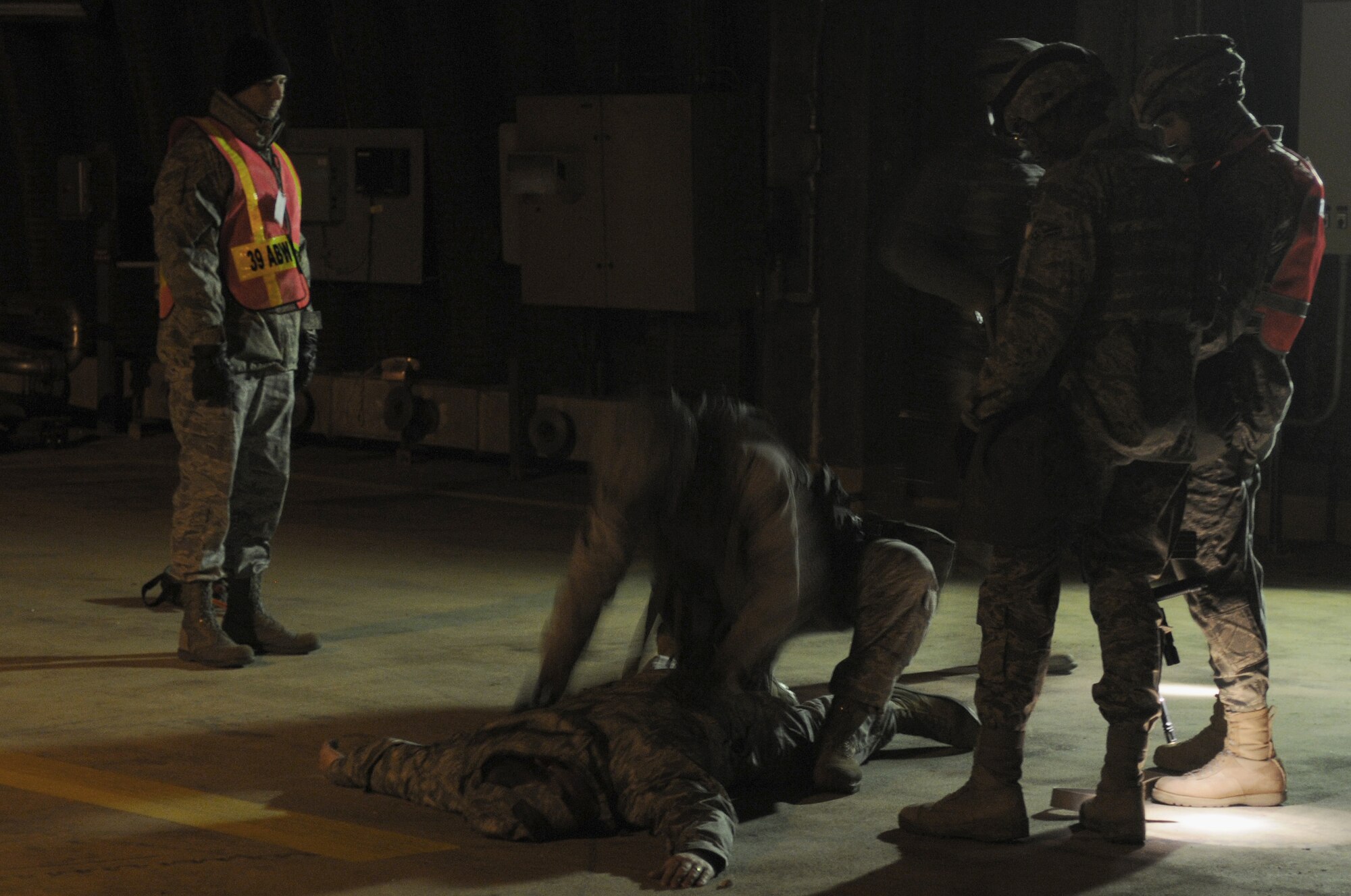 Airmen from the 39th Security Forces Squadron detain an intruder during an exercise Thursday, Feb.11, 2010 on Incirlik Air Base, Turkey.  This exercise was conducted to ensure Airmen follow correct procedures in case of real world intrusion.  (U.S. Air Force photo/Senior Airman Ashley Wood)