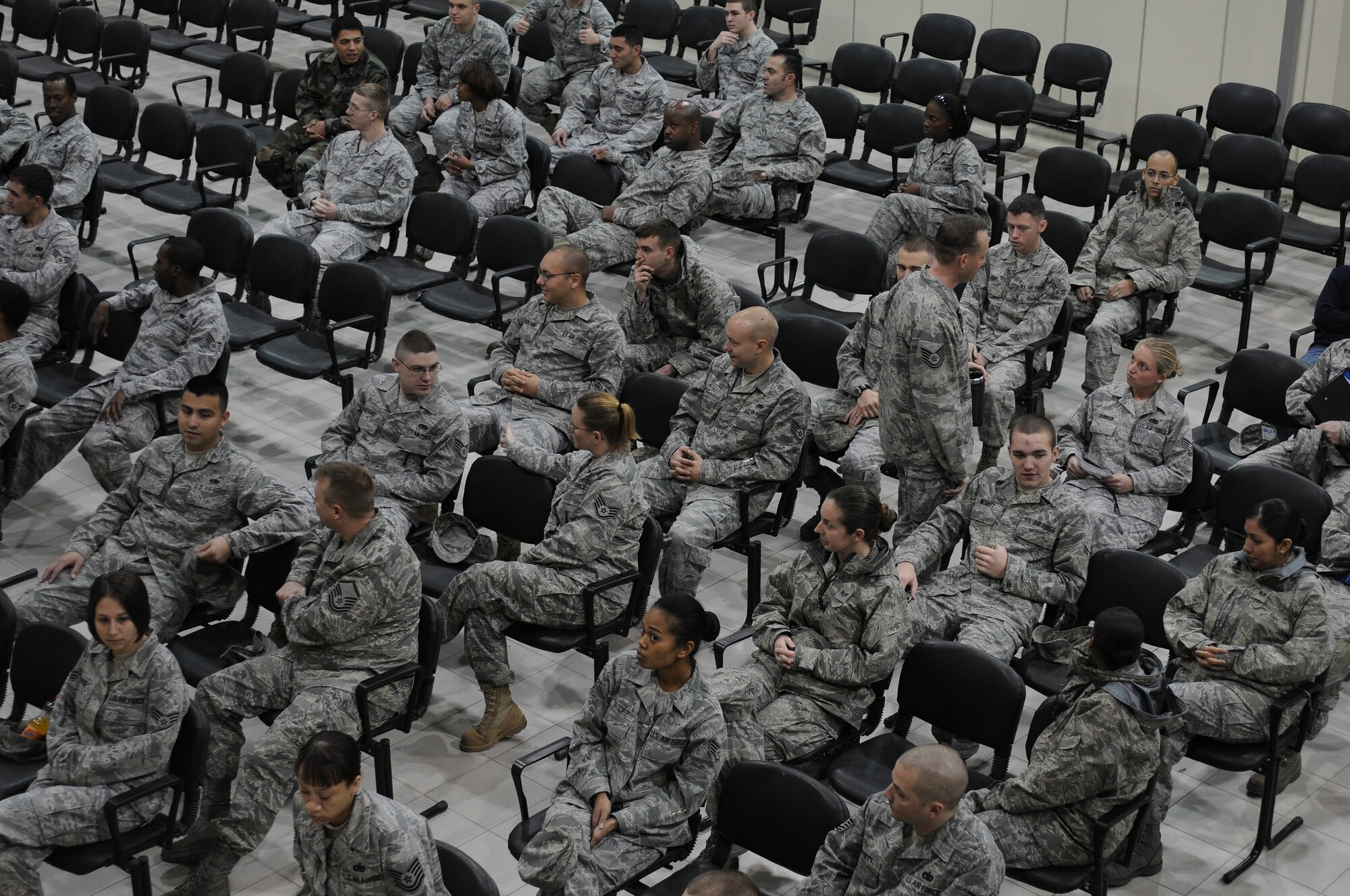 Airmen sit and wait for medical supplies to be handed out during a disease outbreak exercise Thursday, Feb. 11, 2010 on Incirlik Air Base, Turkey.  During this exercise, Airmen are seen by physicians and given the proper dose of medicine needed to prevent the spread of the disease during the exercise.  (U.S. Air Force photo/Senior Airman Ashley Wood)  