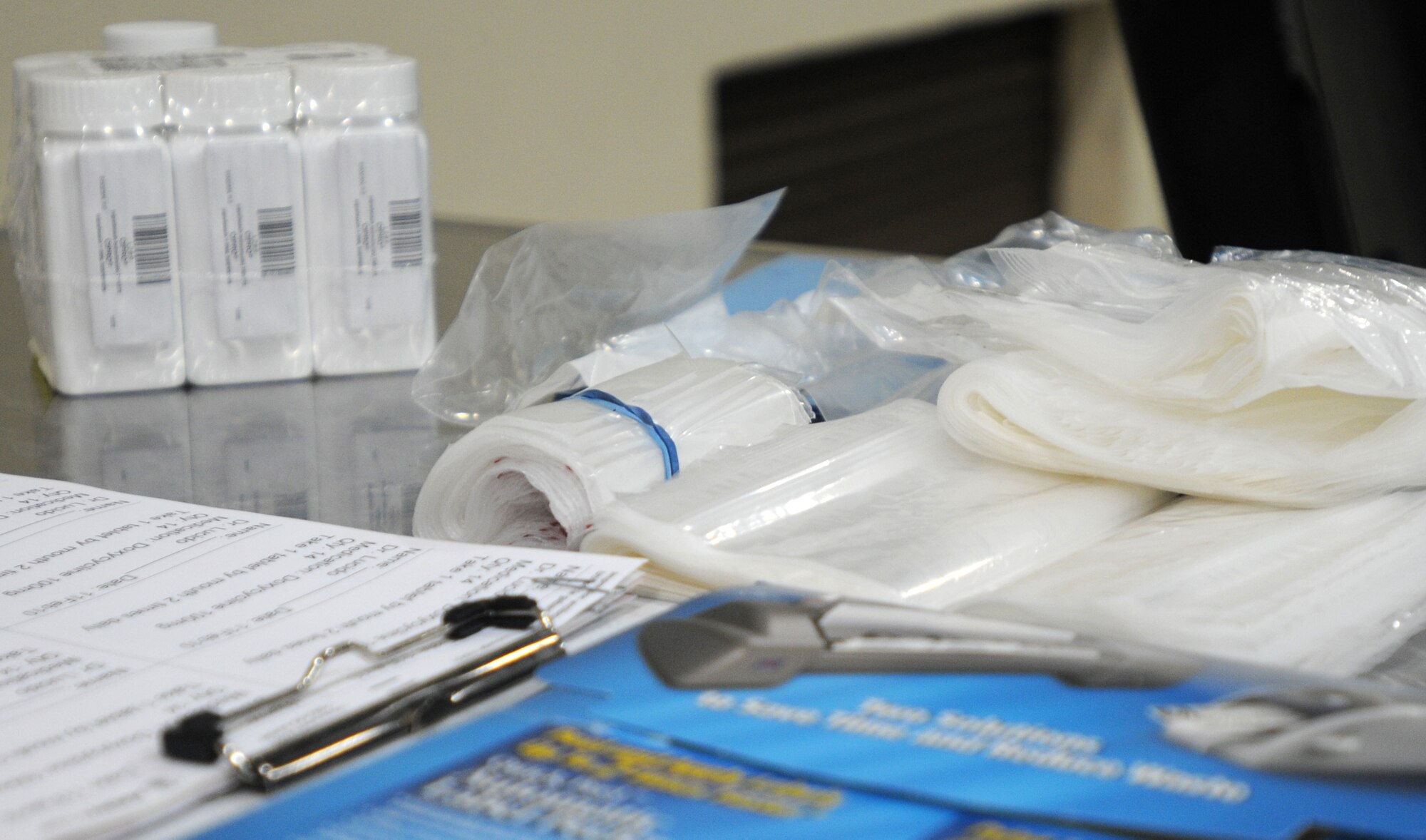 Medical supplies sit on a table for quick access during medical emergencies during an exercise Thursday, Feb. 11, 2010.   The medical supplies were handed out to people as a precautionary measure to prevent outbreaks of illness.  (U.S. Air Force photo/Senior Airman Ashley Wood)  