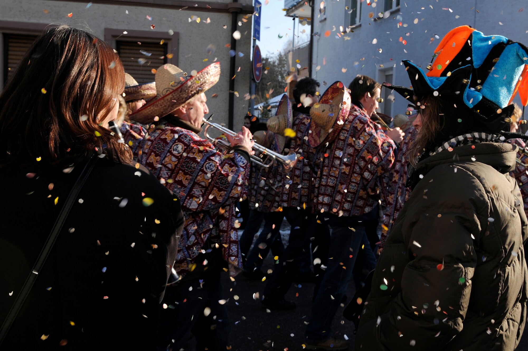 Locals and Kaiserslautern Military Community residents celebrate at a Fasching parade, Ramstein village, Germany, Feb. 16, 2010. This annual event is a pre-Lenten carnival which is celebrated with the donning of wild and fancy costumes to chase away the evil spirits of winter in preparation for spring. (U.S. Air Force photo by Airman 1st Class Brea Miller) 