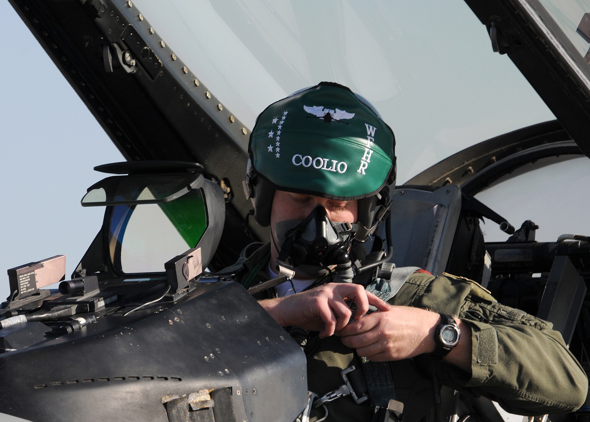 Capt. Neil Gorham, 555th Fighter Squadron, attaches his harness to the seat of an F-16 as he prepares for takeoff on February 2, 2010 at Zaragoza Air Base, Spain.  The 555th deployed here to accomplish training they don't have the ability to do at home station.  (U.S. Air Force photo/Senior Airman Tabitha M. Mans)