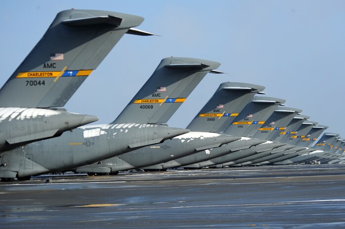 C-17 Globemaster III aircraft sit draped in snow on the flightline at Joint Base Charleston Feb. 13 after an overnight snowstorm delivered more than three inches of snow. During the recent winter months, nightly low temperatures have dropped and the use of deicing machines to clear aircraft of debilitating ice sheets is commonly required. The snowstorm was an uncommon event for the Charleston area, resulting in several delayed takeoffs due to the base's first measurable snowfall in more than 10 years. (U.S. Air Force photo/Senior Airman Daniel Owen)