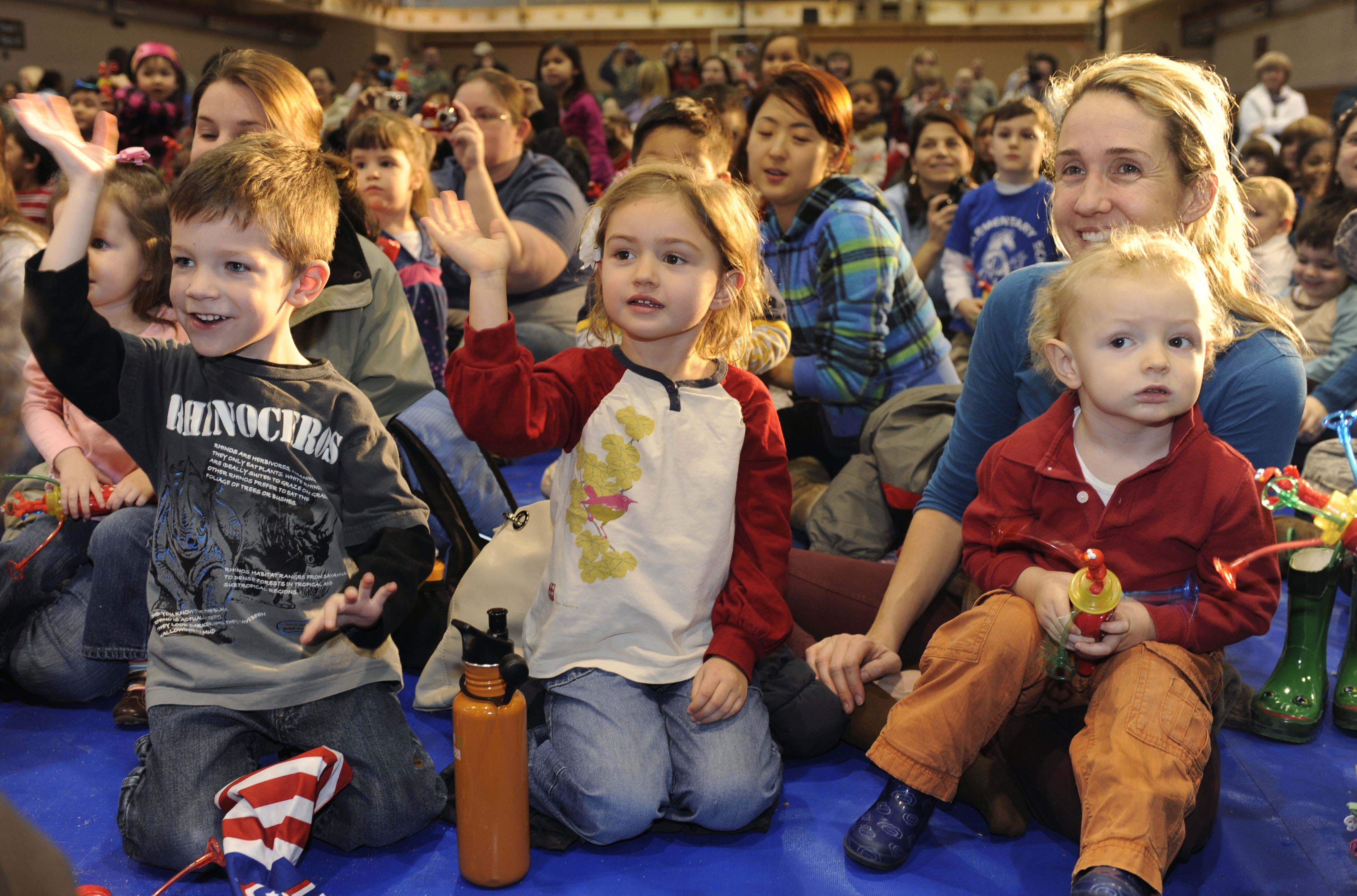 School age children enjoy a Sesame Street performance featuring five of the muppets in the base gym at Osan Air Base, Republic of Korea Feb. 12.  In January, the USO and Sesame Workshop kicked off “The Sesame Street/USO Experience for Military Families” tour. This year the tour will travel to Japan, Korea and Guam over the course of two months and deliver more family friendly shows tailored specifically for military families at 13 military installations.