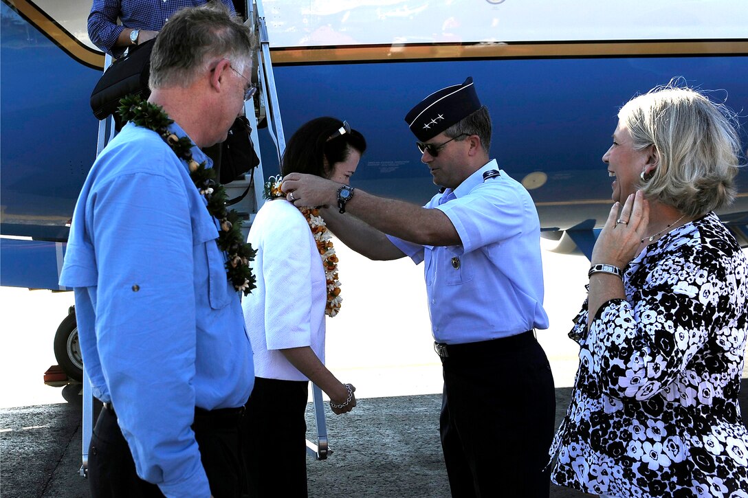 Air Force Lt. Gen. Daniel J. Darnell, deputy commander, U.S. Pacific Command, welcomes Deputy Defense Secretary William J. Lynn III and his wife, Mary Murphy, on Hickam Air Force Base in Honolulu, Hawaii, Feb. 16, 2010.