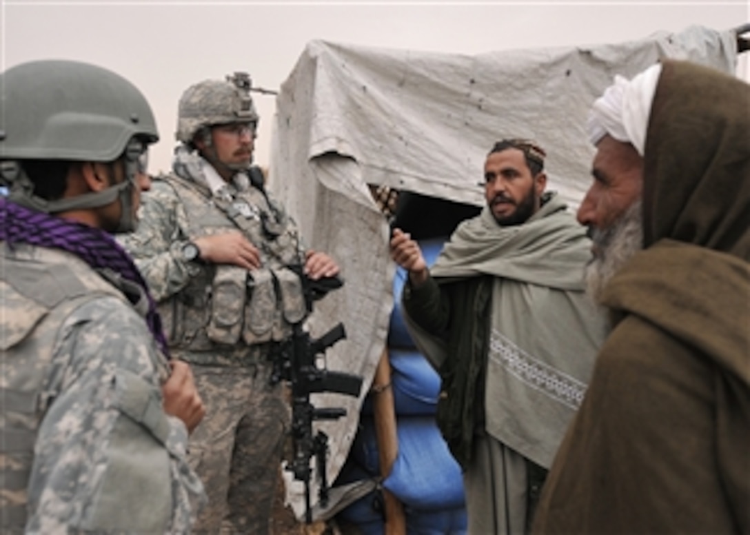 U.S. Army 1st Lt. Morgan Boyd, from 8th Squadron, 1st Cavalry Regiment, meets with bazaar shop owners in Hutal, Afghanistan, on Feb. 5, 2010.  