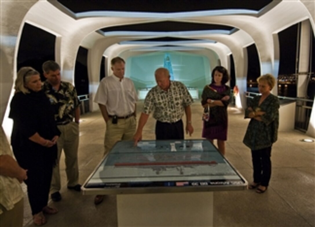 Deputy Secretary of Defense William J. Lynn III and wife Mary Murphy listen to the Commander of the U.S. Pacific Command Adm. Robert F. Willard while taking a tour of the USS Arizona Memorial in the Honolulu Harbor, Hawaii, on Feb. 16, 2010.  