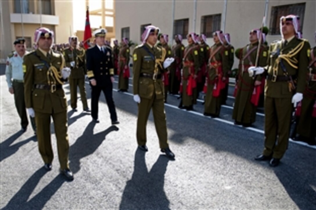 Jordanian Chief of Defense Gen. Khalid Sarayreh escorts U.S. Adm. Mike Mullen, chairman of the Joint Chiefs of Staff, during an honors arrival ceremony at the Ministry of Defense in Amman, Jordan, Feb. 16, 2010. Mullen is touring the region, visiting with key partners and allies.