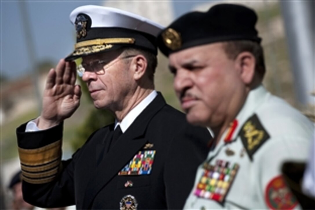 U.S. Navy Adm. Mike Mullen, chairman of the Joint Chiefs of Staff, salutes as he and Jordanian Chief of Defense Gen. Khalid Sarayreh attend an honors arrival ceremony at the Ministry of Defense in Amman, Jordan, Feb. 16, 2010. Mullen is touring the region, visiting with key partners and allies.